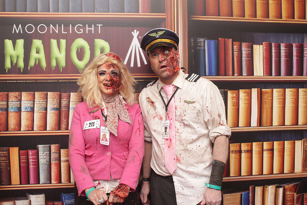 Halloween party large print of a zombie couple in front of a library bookshelf backdrop