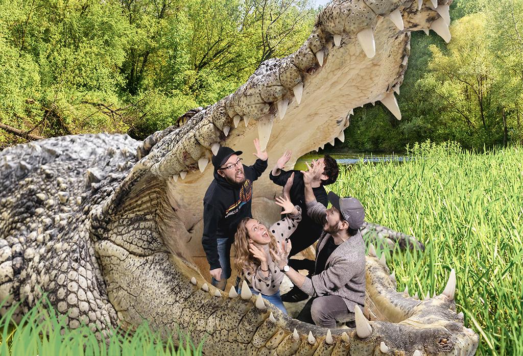 Immersive green screen photo of four friends inside the jaws of a giant crocodile