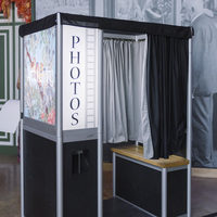 Traditional photo booth with curtain and bench