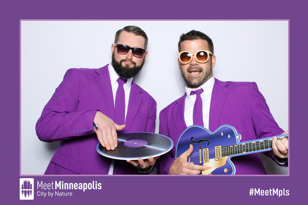 Meet Minneapolis branded 4x6 print of two men in purple suits with a record and guitar props