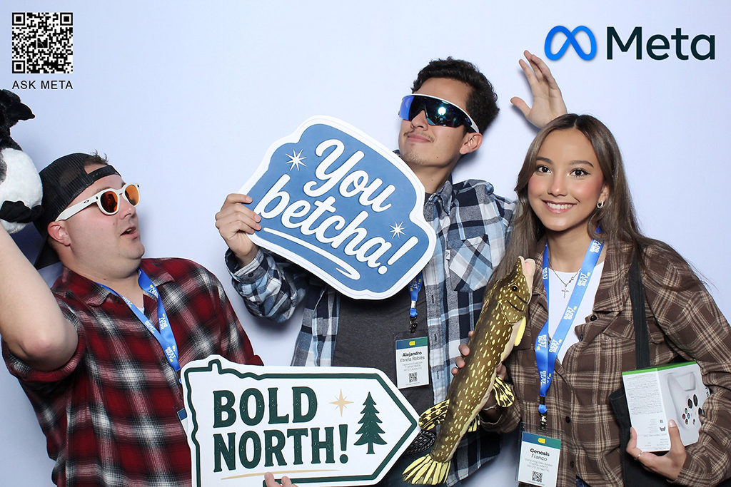 Meta brand activation print of attendees holding You Betcha and Bold North sign props