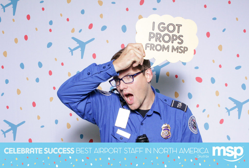 MSP airport staff celebration print of a TSA officer holding an I Got Props From MSP sign