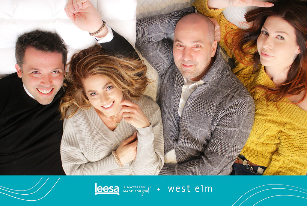 Overhead open style photo booth print of four guests lying on a mattress at a Leesa and West Elm event