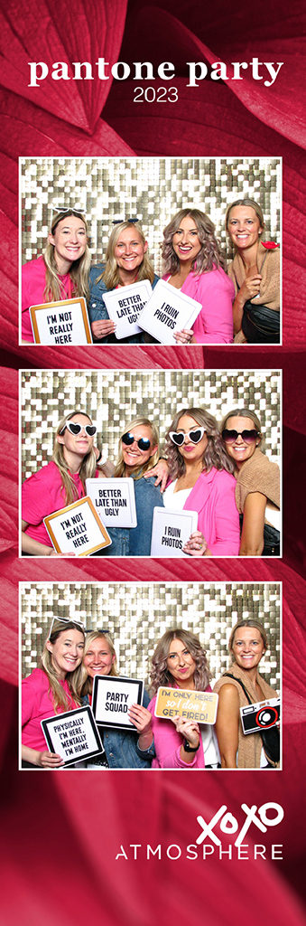 Pink Pantone party photo strip with four women holding funny sign props on a gold sequin wall