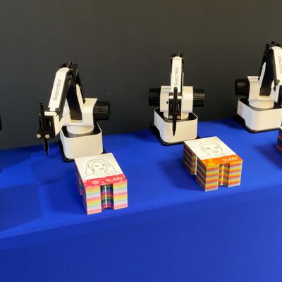 A row of Sketch Bot robot arms ready to draw