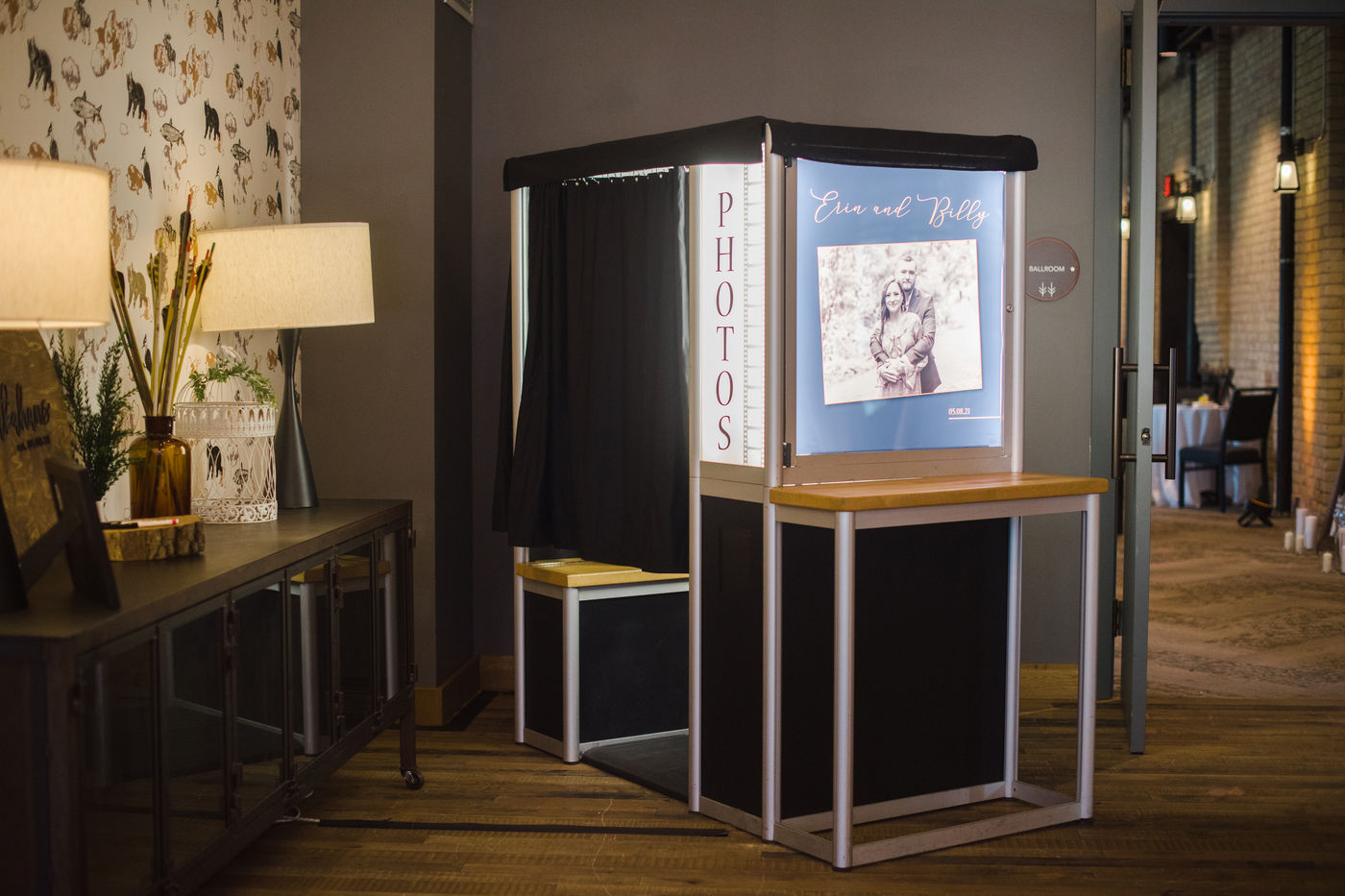 Traditional enclosed photo booth with a curtain at a Minneapolis event