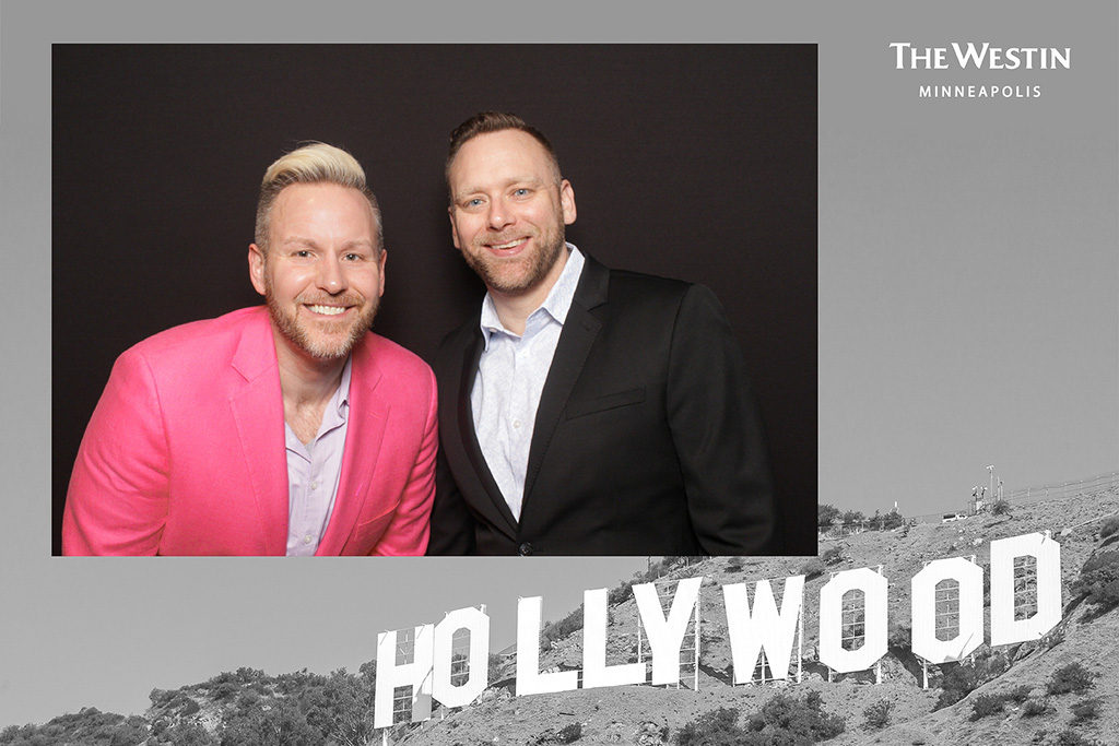 Hollywood sign themed event print from The Westin Minneapolis with two men in blazers